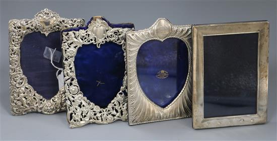 Three late Victorian silver mounted photograph frames and one later silver photograph frame.